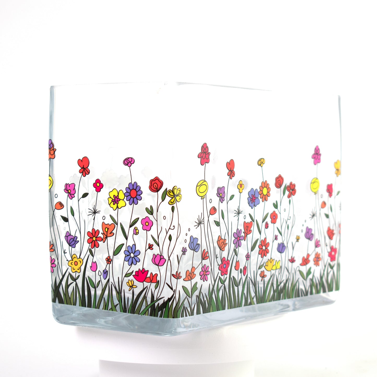 Clear glass vase with a colourful wildflower design featuring red, purple, yellow, and orange flowers — size 20x10x15 cmH.