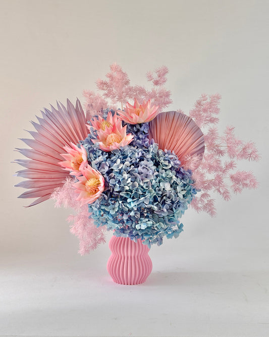 Bouquet of dried flowers in a pink vase