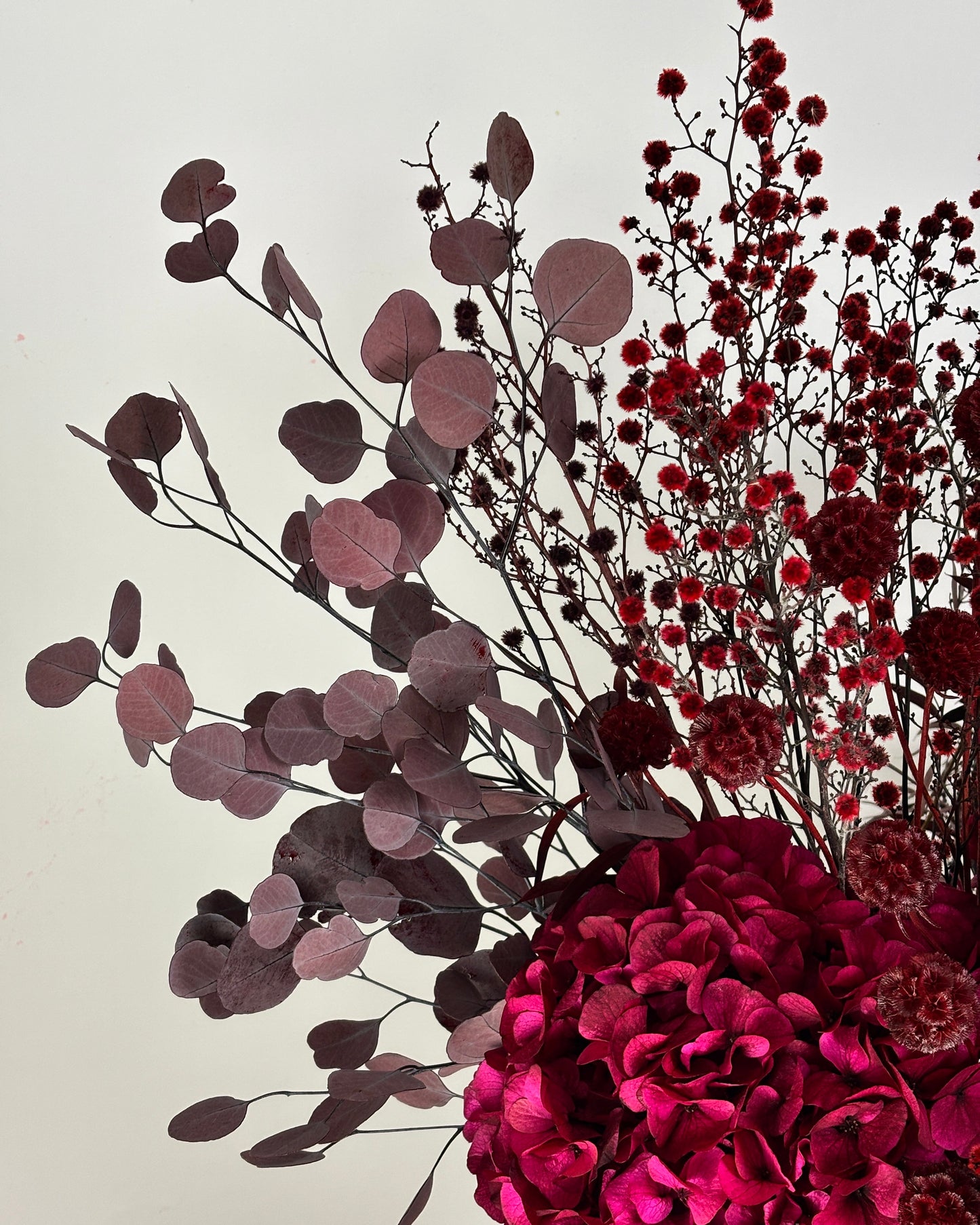 Bouquet of red flowers on a light background