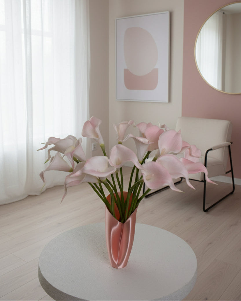 Bouquet of pink flowers with a white circular object in the foreground on a gray background