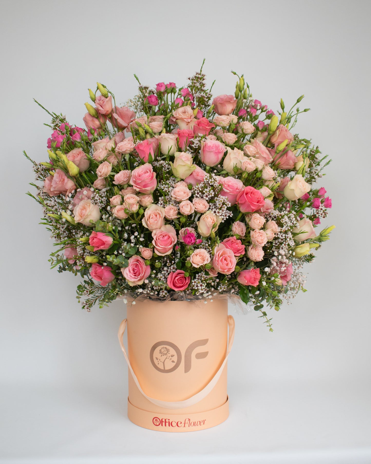 Romantic pink rose bloom box featuring layers of premium roses and seasonal flowers