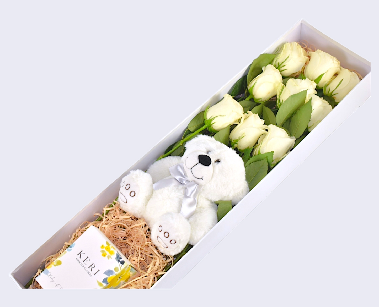 White roses Teddy bear and candle 