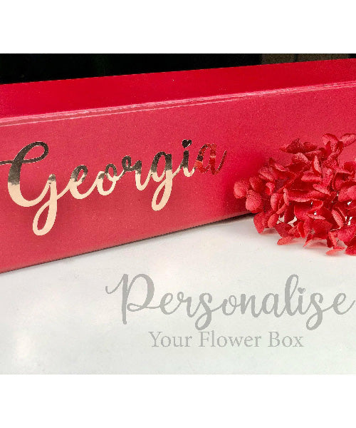 Red Roses Luxe Box from OfficeFlower featuring 12 or 24 premium red roses, an optional teddy bear, and heart tin chocolates