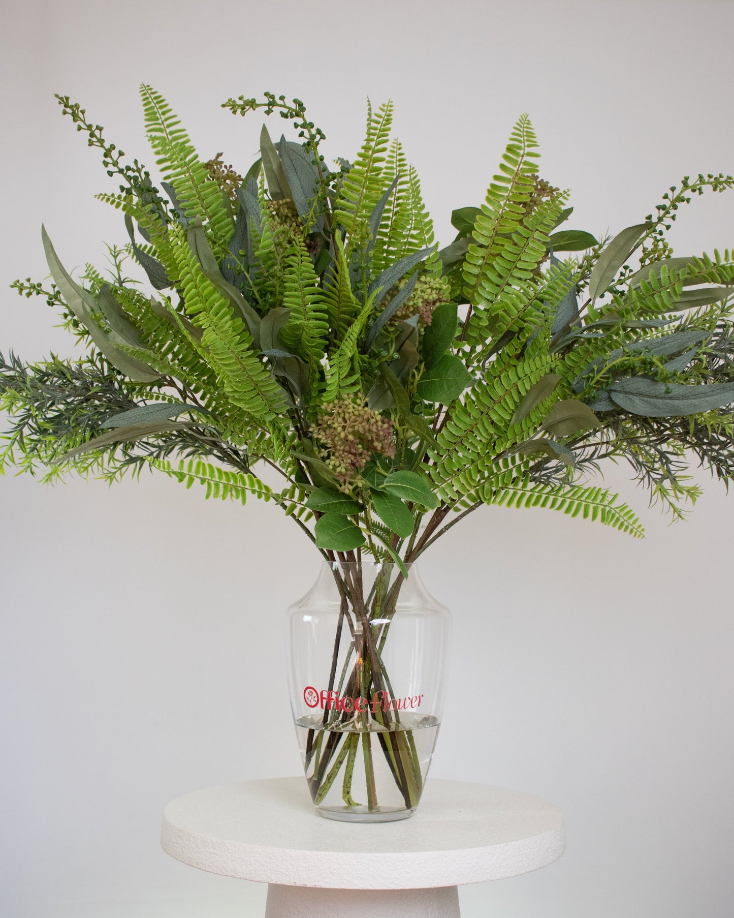 Artificial green foliage arrangement