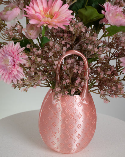 Styled in a modern pink luxury-inspired bag vase