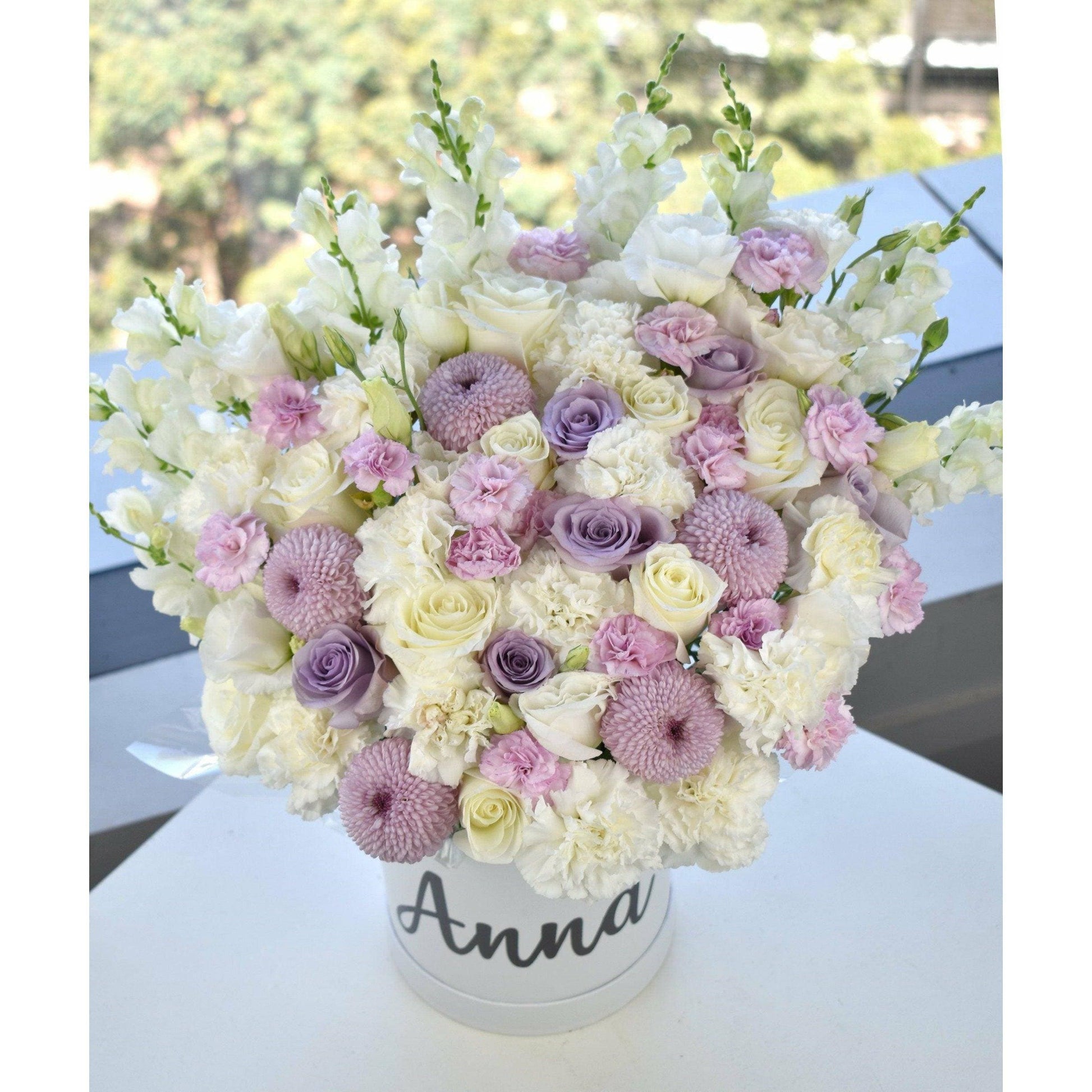 Stunning flower box with purple and white flowers