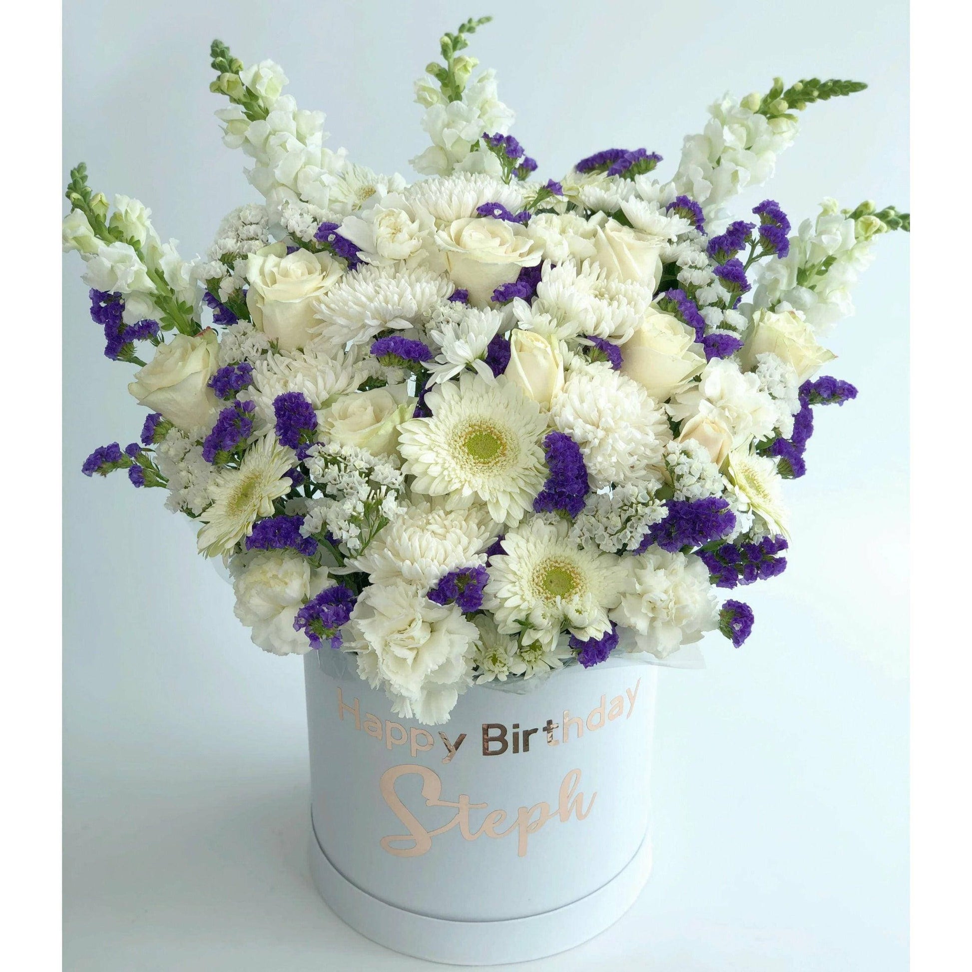 White and Blue Box featuring white roses, Gerberas, Statice, and Antirrhinum