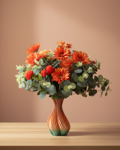 Artificial flower arrangements in a vase on a wooden table with a brown