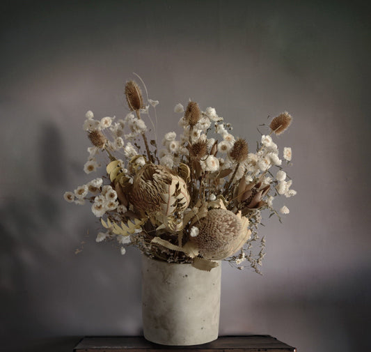 Rustic dried flowers arranged in a stylish vase Perfect for home decor or as a thoughtful gift