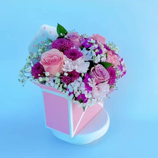 Pink purple flowers in envelope box 