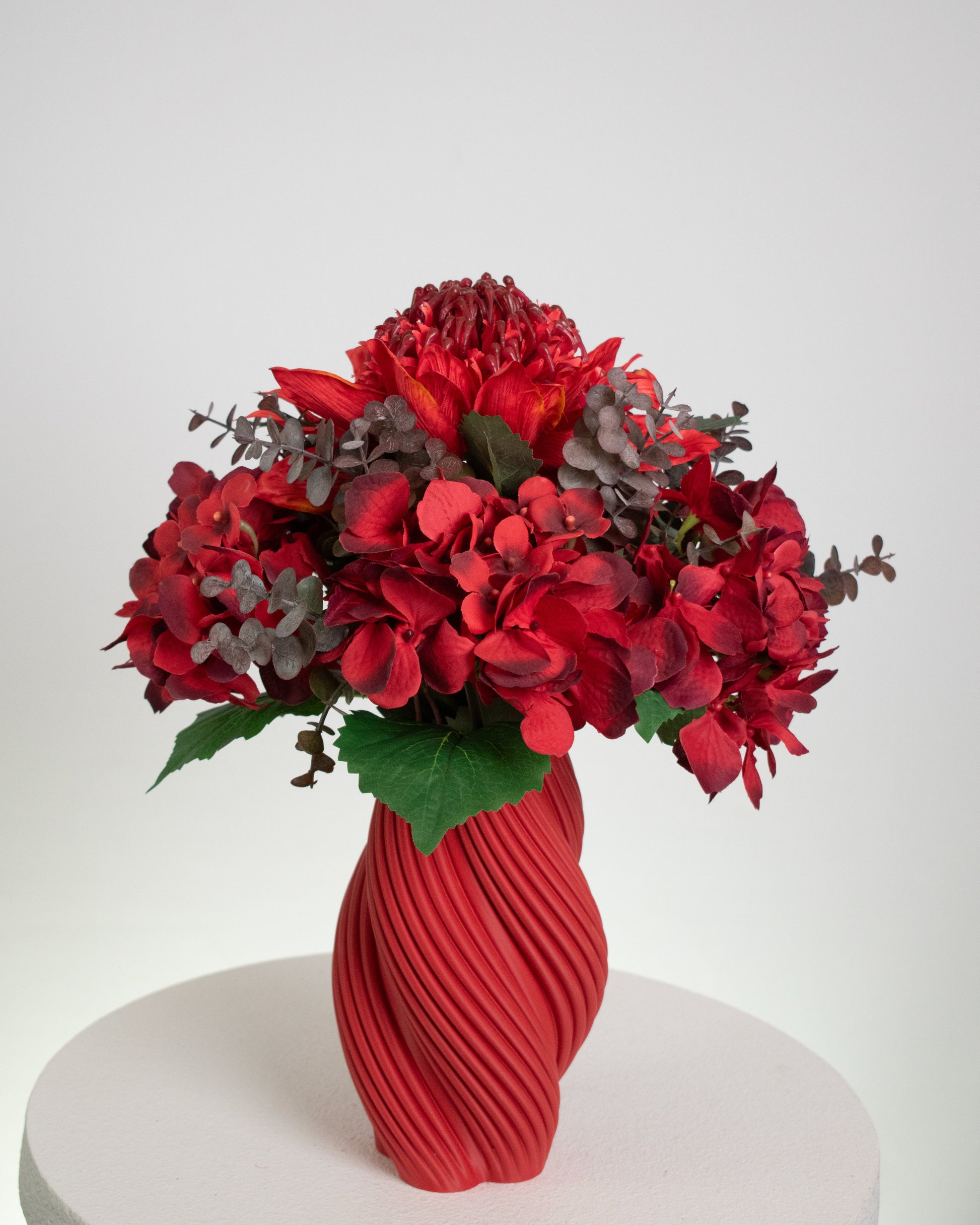 High-quality artificial flowers in rich red tones