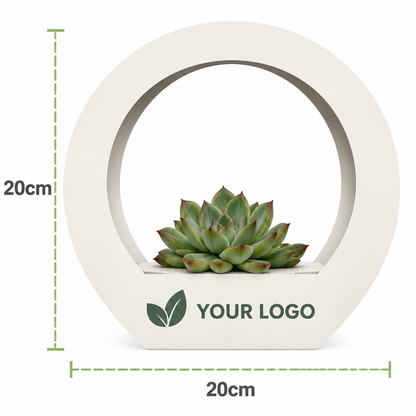 A circular white planter with a small succulent inside, shown with green dashed dimension lines indicating 20cm height and 20cm width, plus placeholder text reading YOUR LOGO on the front.