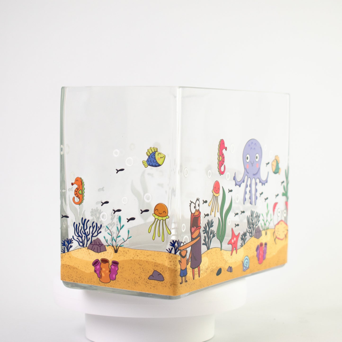 Clear glass vase with a colourful underwater scene featuring octopus, crab, jellyfish, fish, and coral — size 20x10x15 cmH.